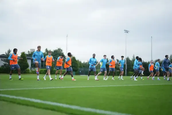 Who are the 14 new names and faces training with Manchester City in pre-season this week?